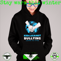 Model wearing Zombie Sport Co’s black Kids Against Bullying hoodie with a blue-and-white globe graphic and Learn Jiu Jitsu text.