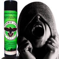 A tube of Zombie Licker Scabicide bug balm is shown next to a black and white photo of a person wearing a knit hood over their eyes, with their mouth wide open in a screaming expression.